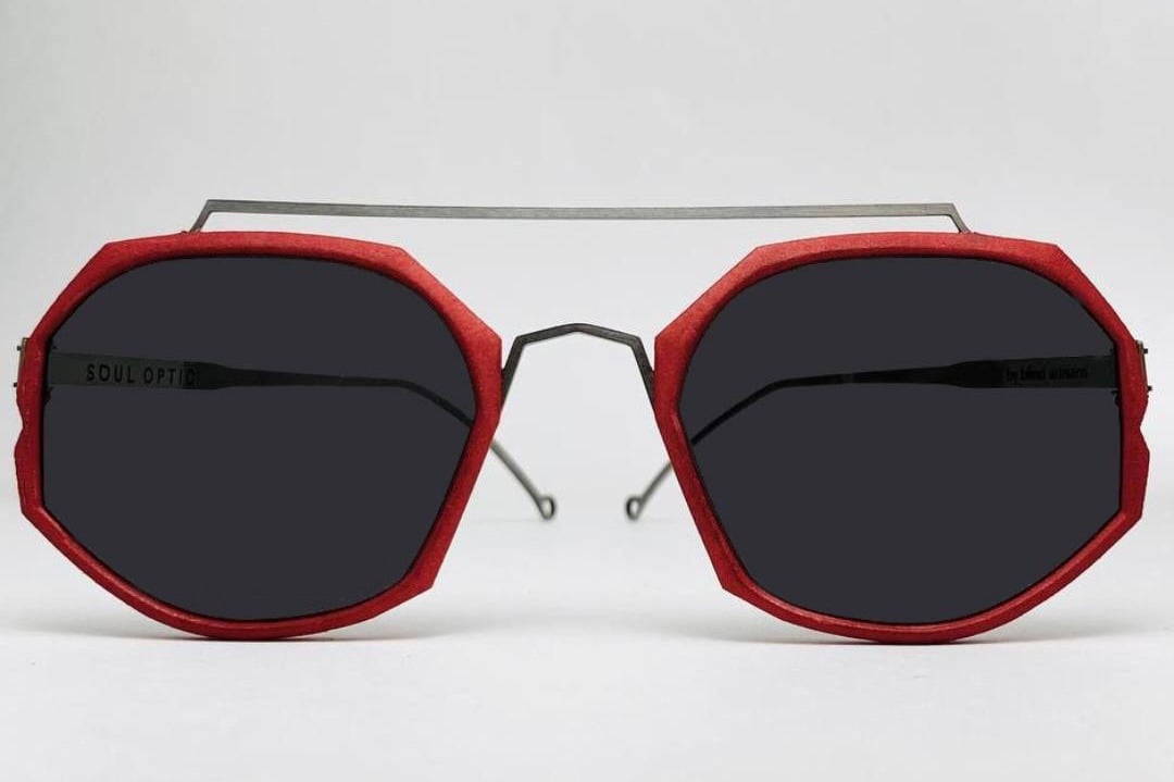 Sunglasses with a thin red frame