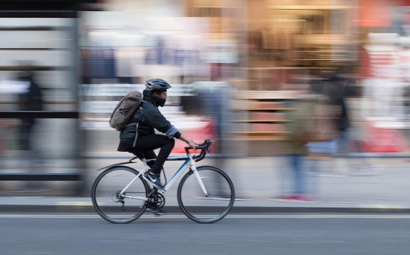 Cyclist on a UK street with blurred background 