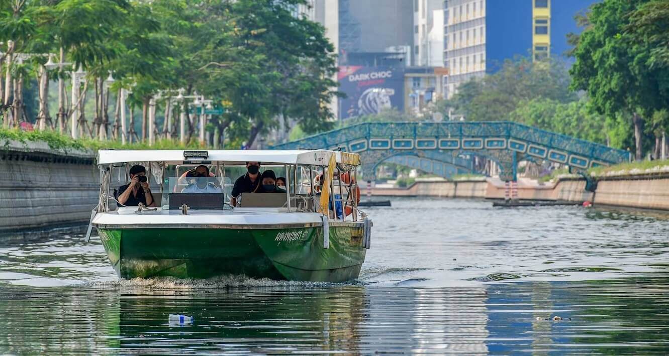 Green boat on a canal in Bangkok 