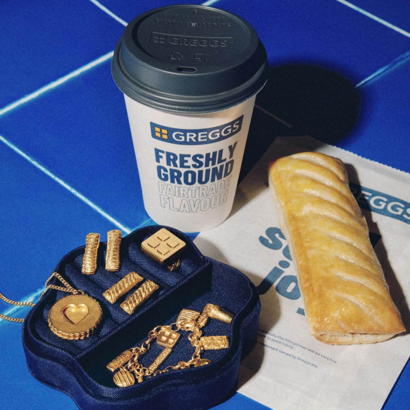 Next to a Greggs coffee-to-go and sausage roll, its pieces of gold-plated jewelry 