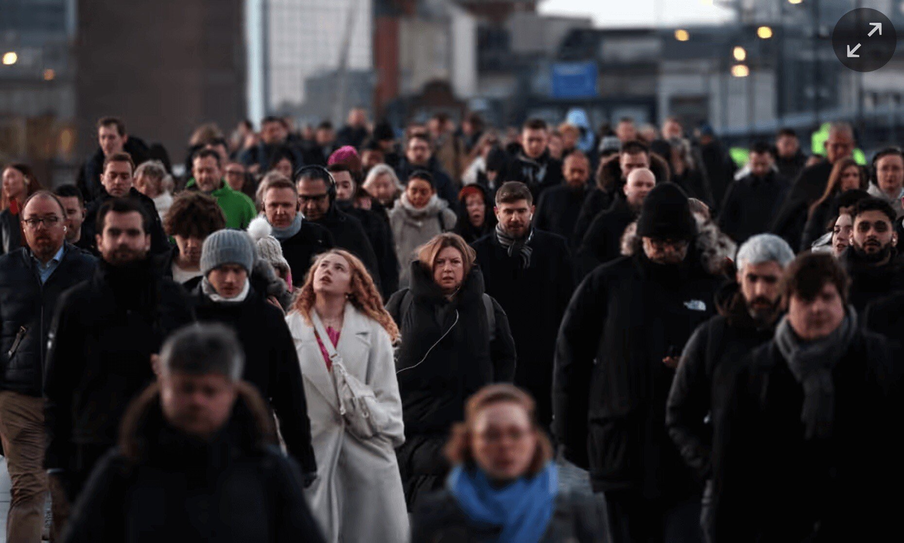 Commuters in winter coats walking to work 