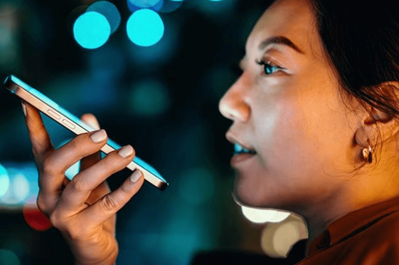 Woman speaking into a phone 