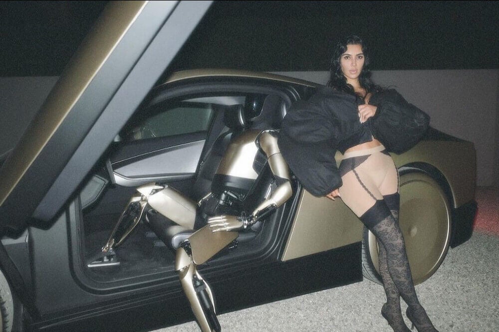 Kim Kardashian posing with Optimus and Tesla’s Cybercab 