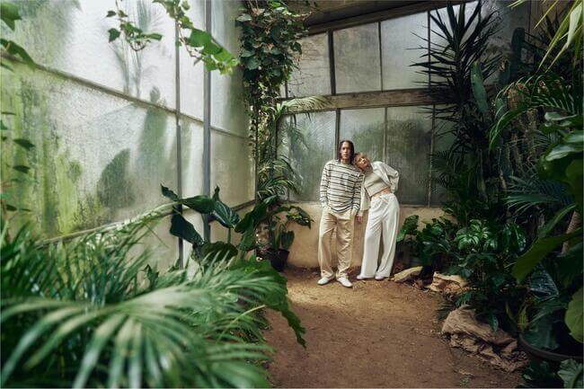 Two people in a greenhouse 