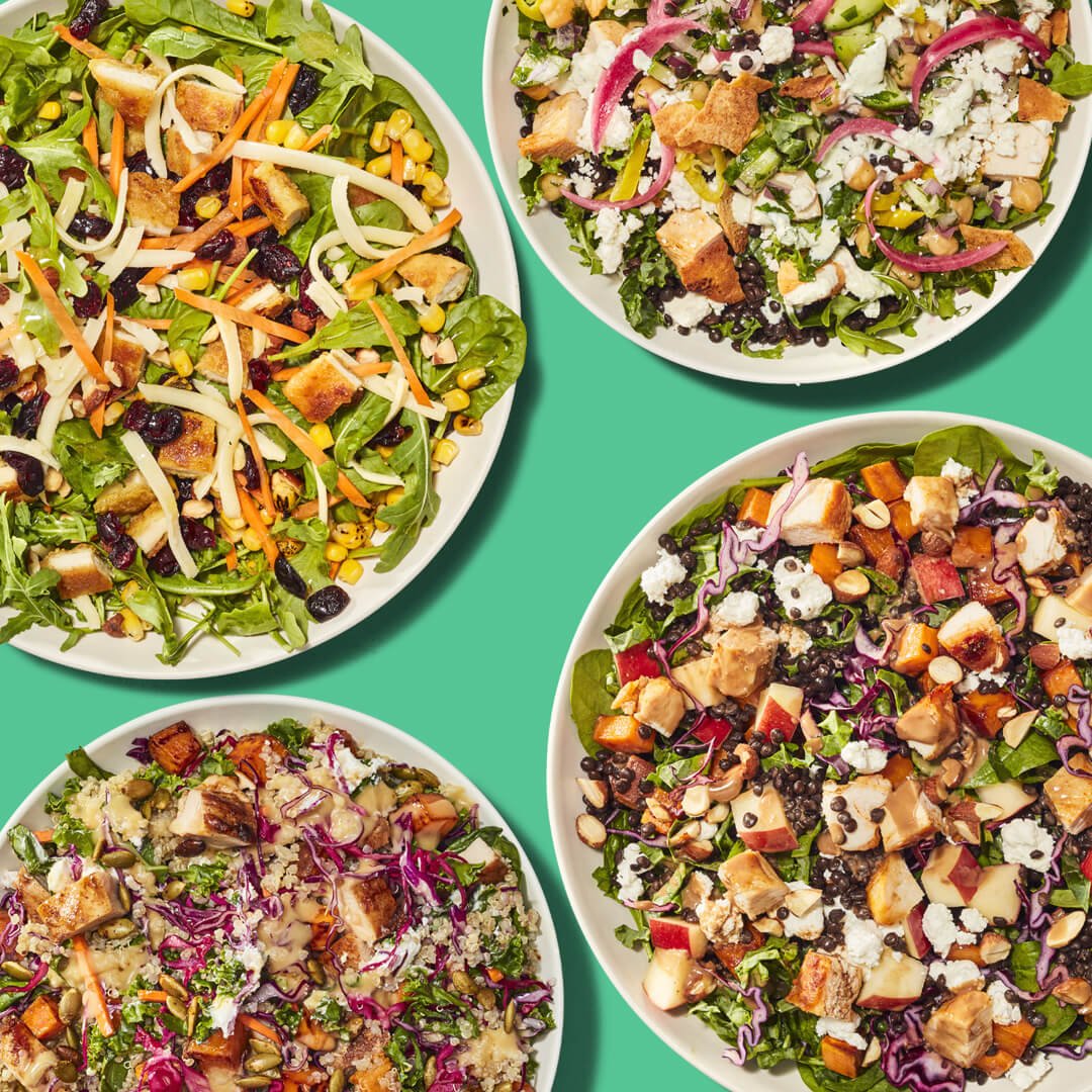 Four bowls of Just Salad's salads 