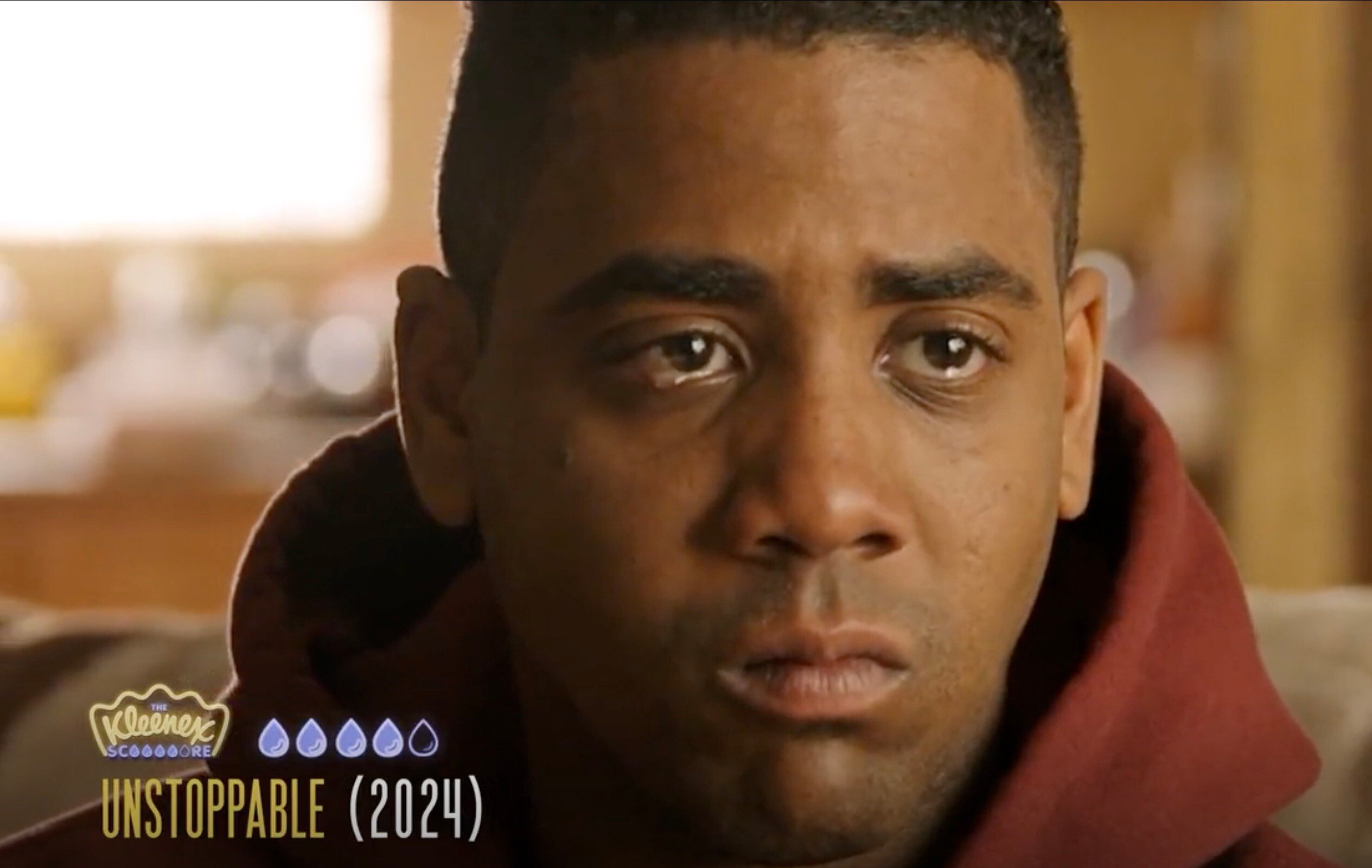 Still from the movie Unstoppable, showing Jharrel Jerome tear up 