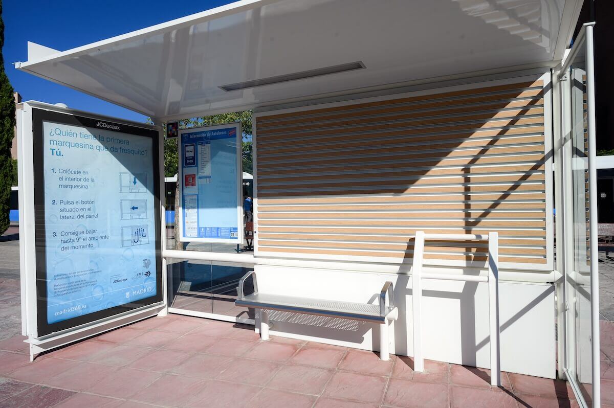 A bus stop shelter in Madrid featuring an evaporative cooling panel 