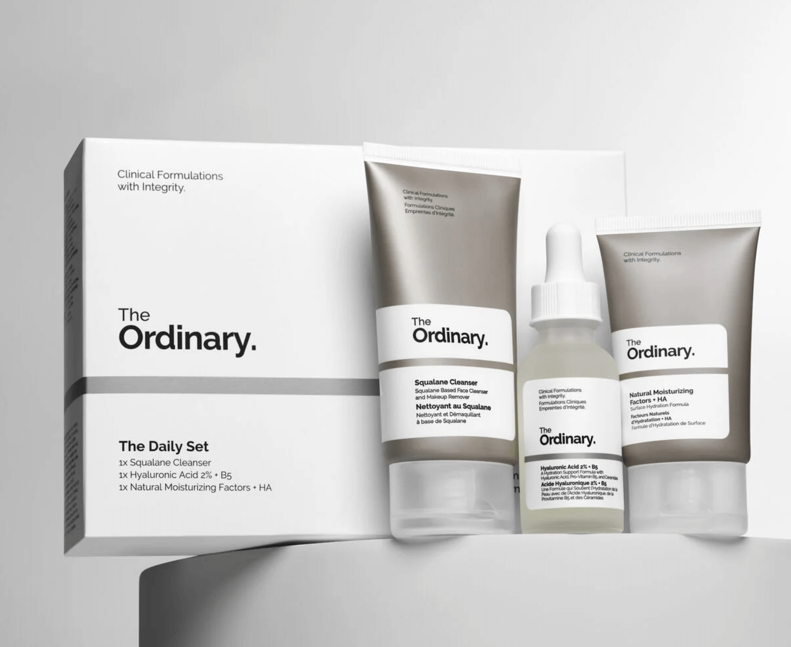 Side by side, the three skincare products included in The Daily Set