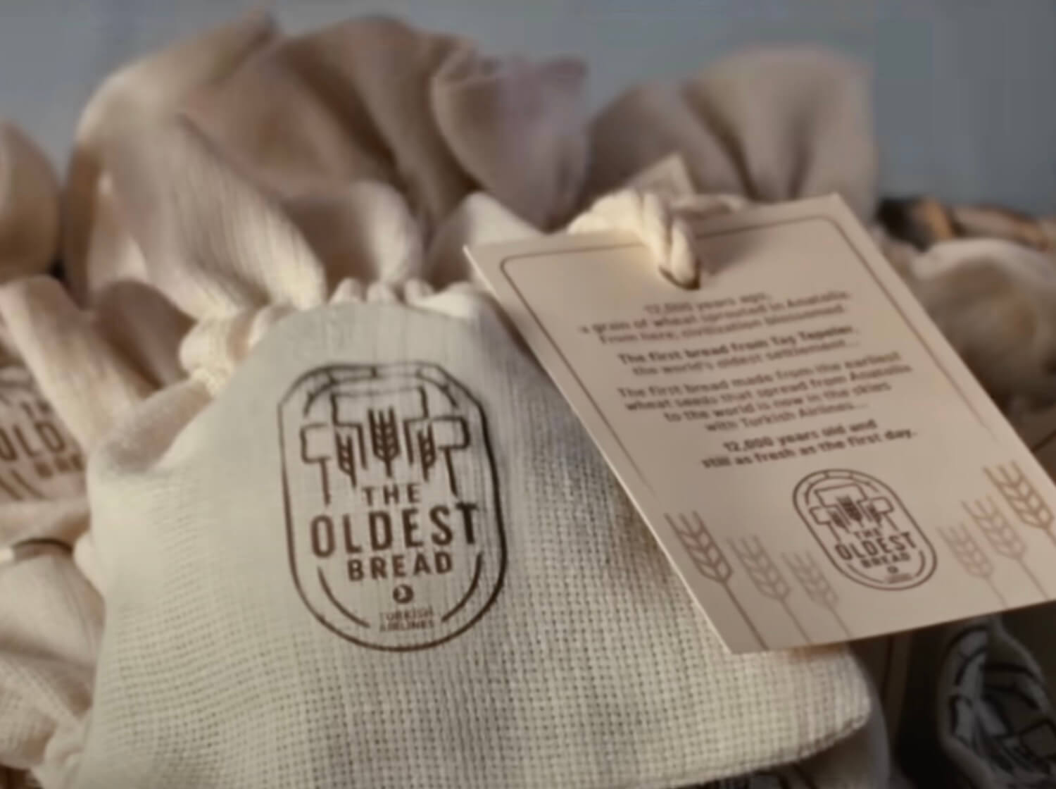 Small cloth bags marked 'The Oldest Bread' 